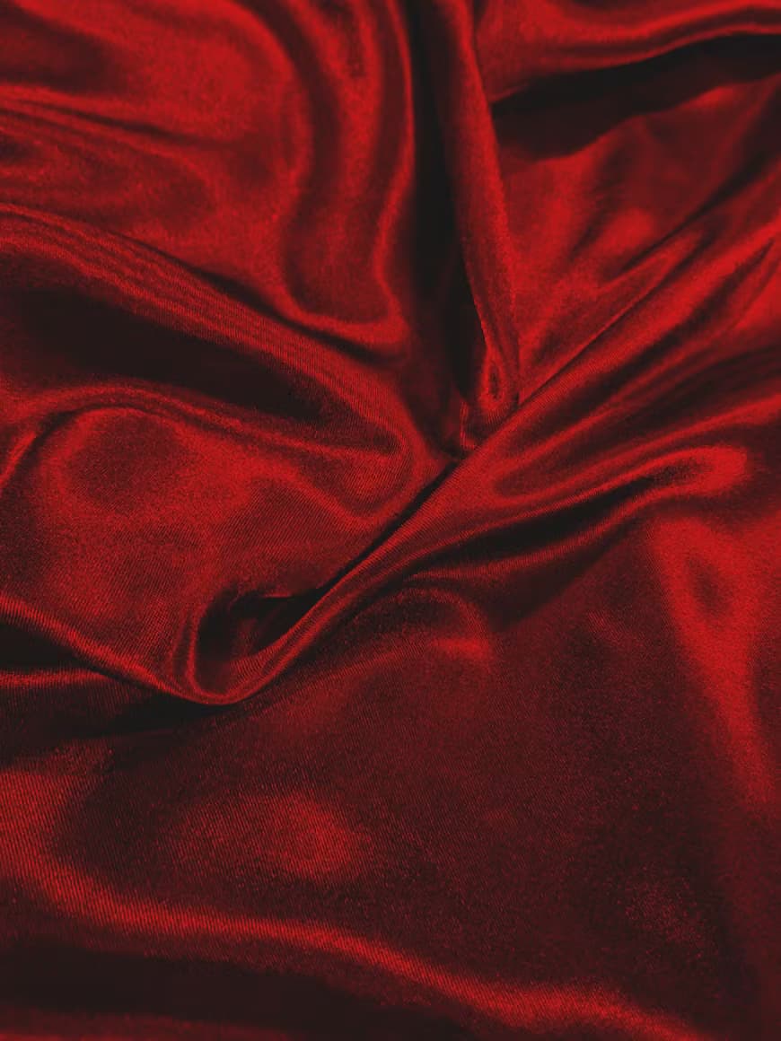 Deep red theatre velvet, folded and lit